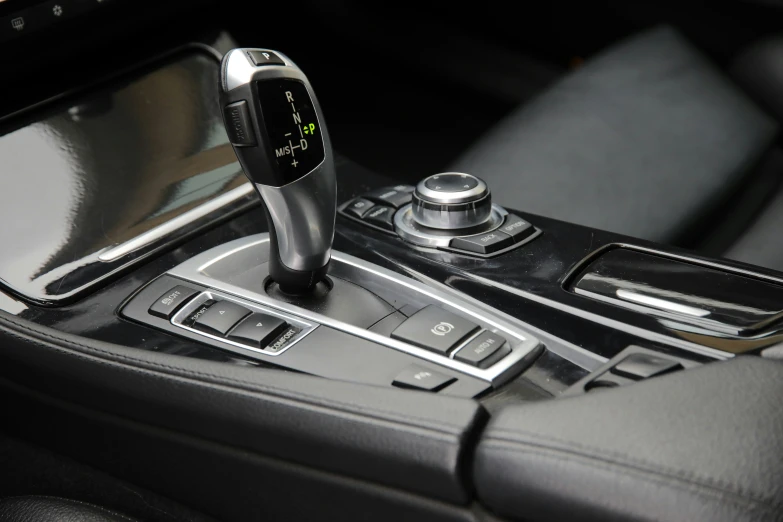 the view from inside the car shows a black steering wheel