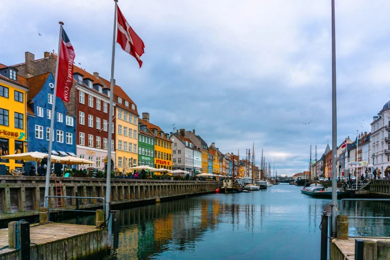 colorful buildings along the river side on a cloudy day