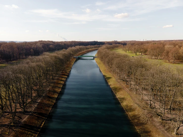 an aerial view shows the river flowing into the distance