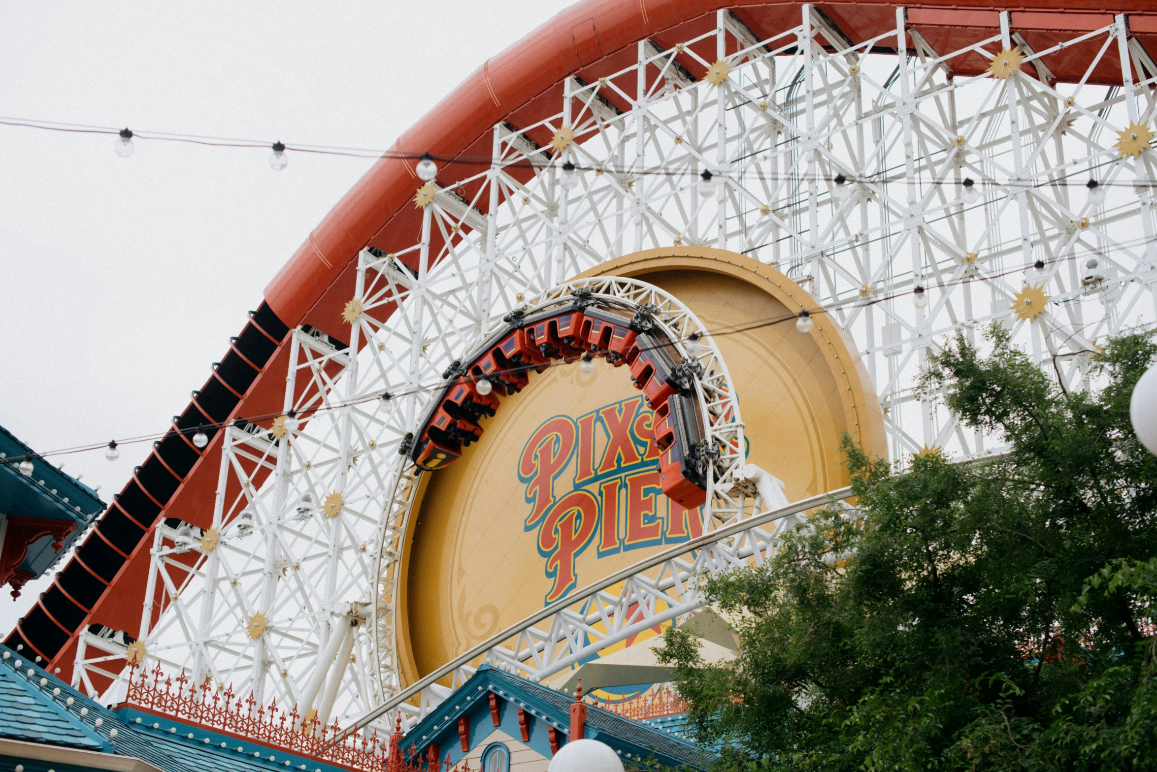 a large roller coaster with an open roof