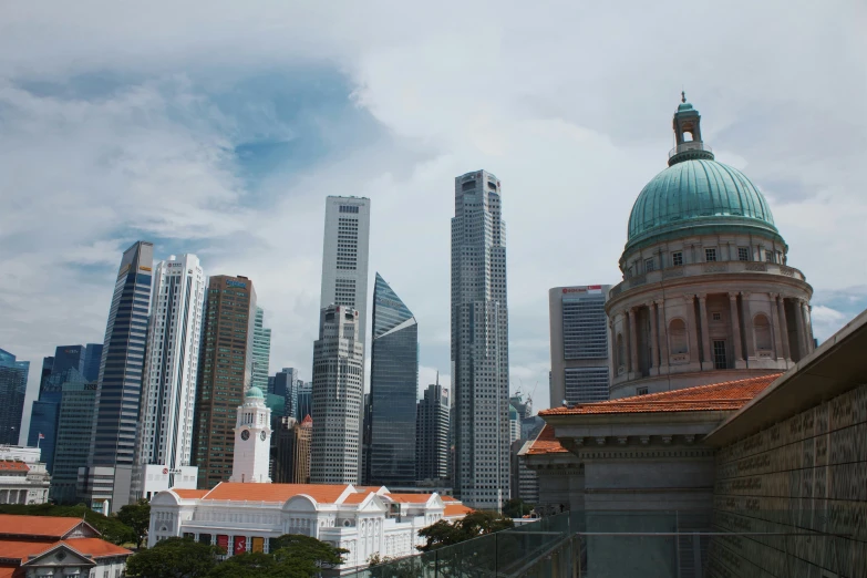 city buildings and a dome are in the foreground of this s