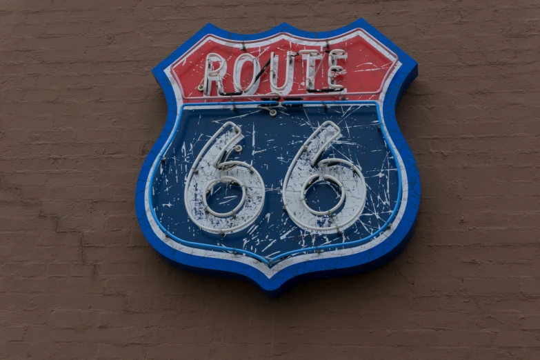 a road sign on the side of a building