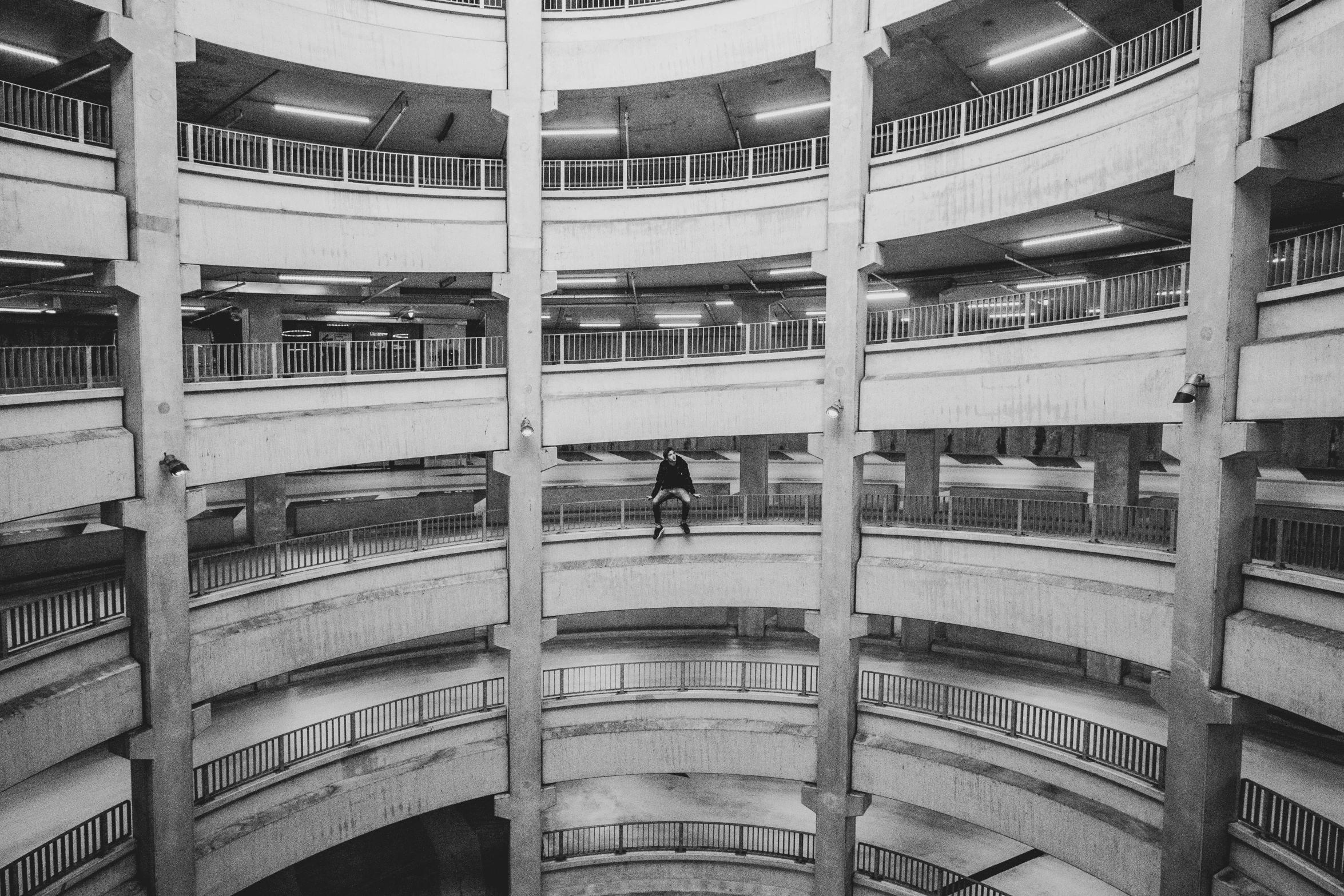 a person is looking down at a building