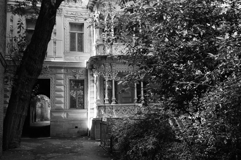 old house with lots of windows is in black and white