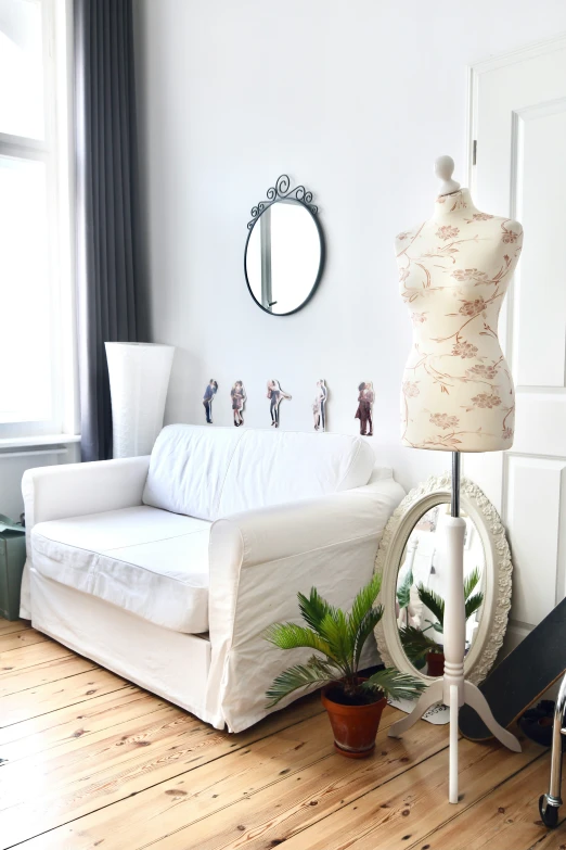 a living room with lots of white furniture