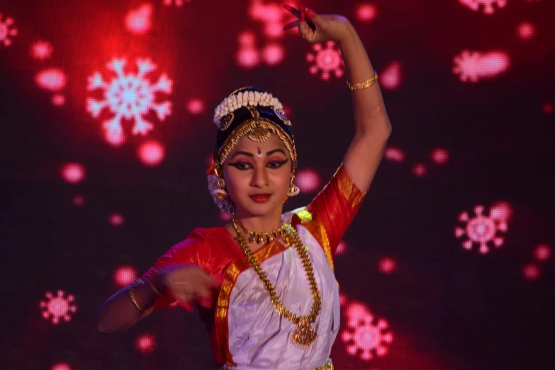 a woman is performing on stage in a dance costume