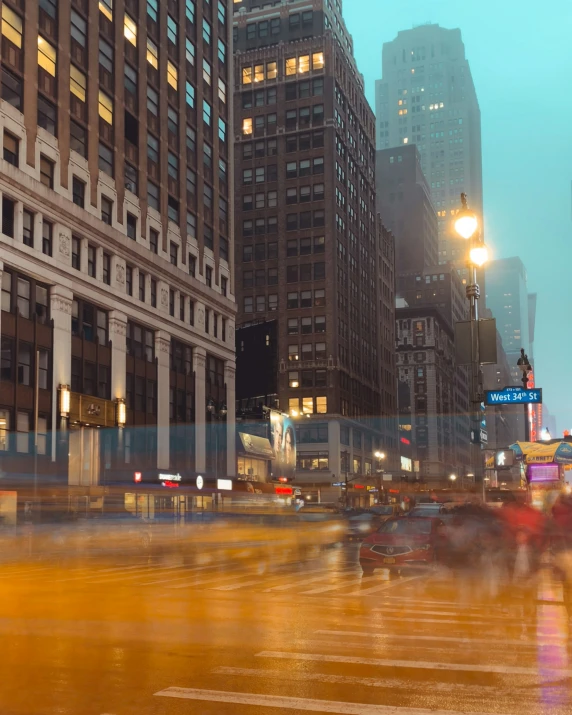 several cars and people on city street at night