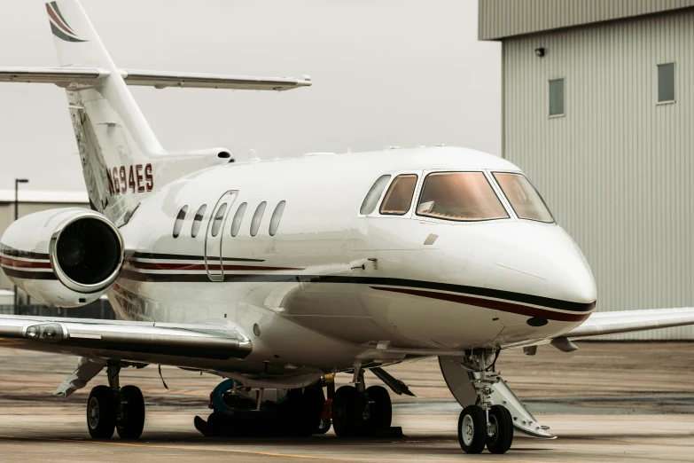 a large white plane sitting on top of an airport runway