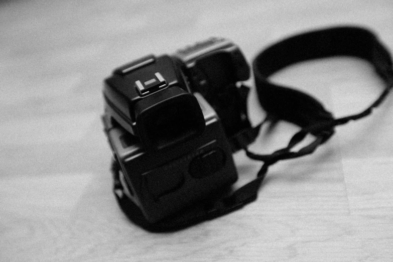 a black and white po of a camera strap