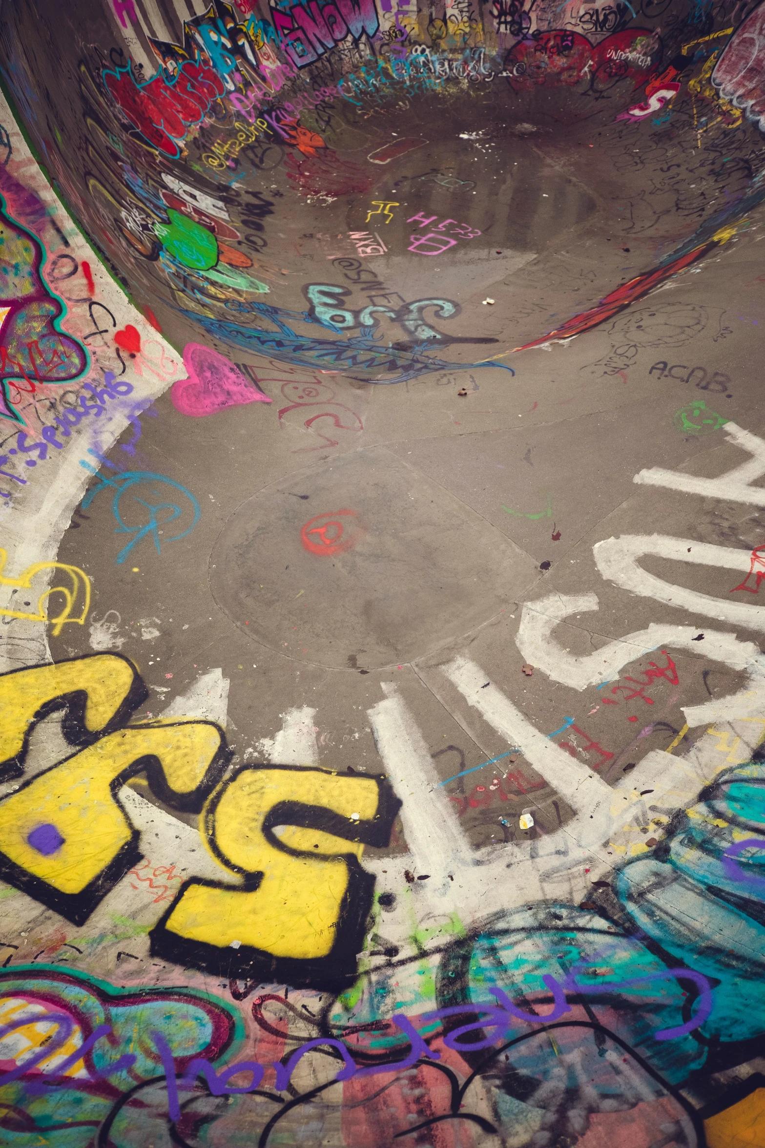 an image of a boy doing tricks in a skateboard park