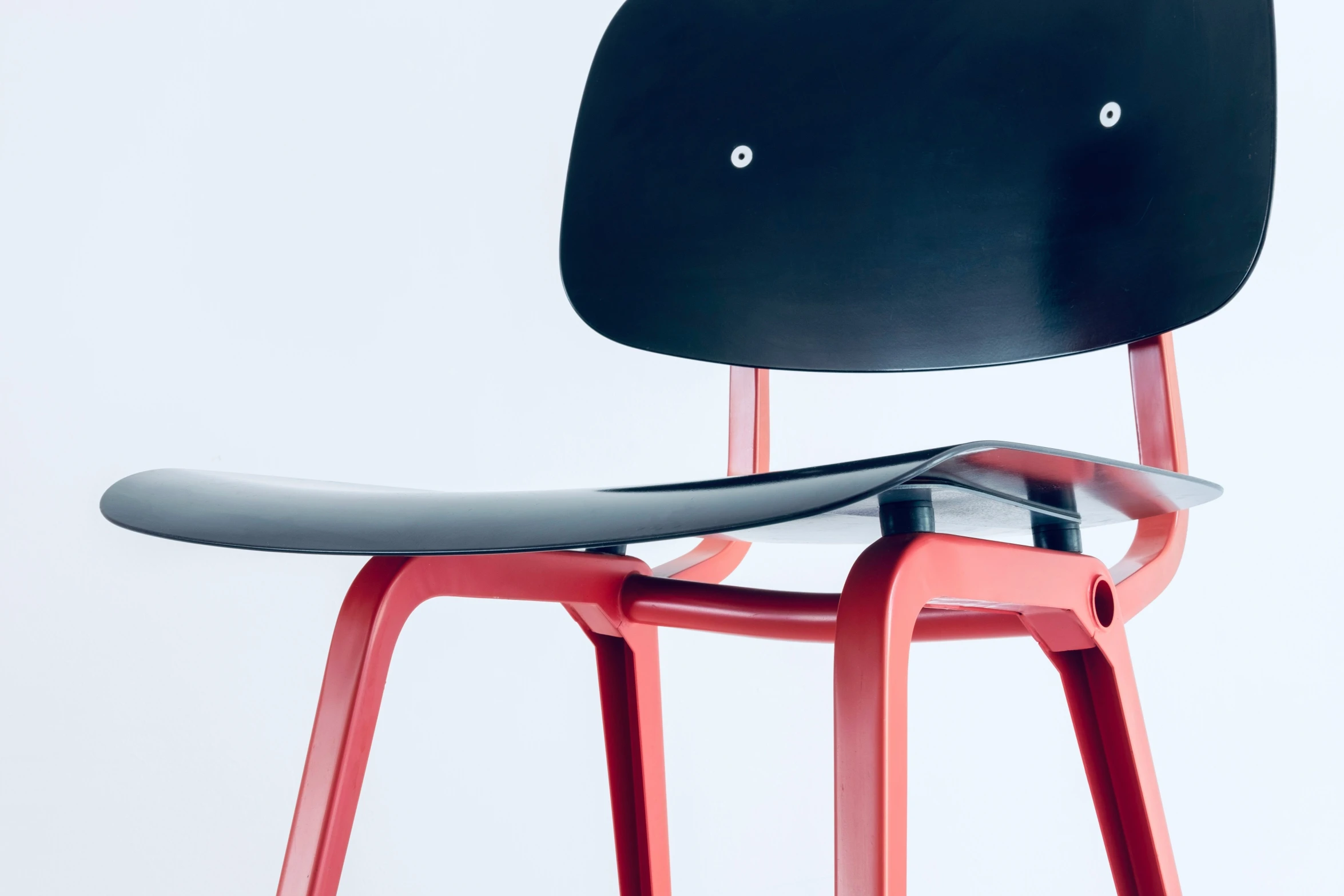 an upholstered chair that's bent to expose the seat