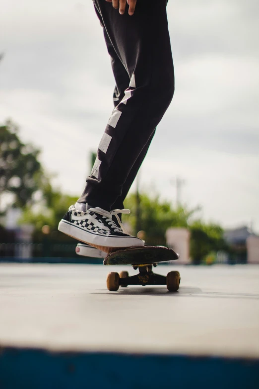 a person riding on the back of a skateboard