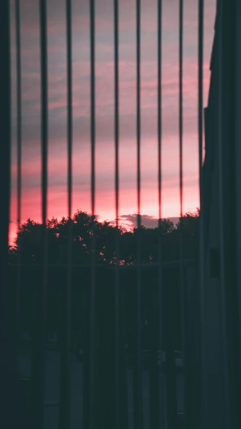 a picture taken through the bars of a window