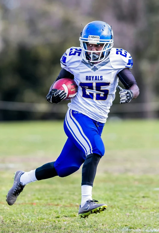 a football player is running with the ball