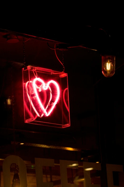 a sign displaying lights in a dark room