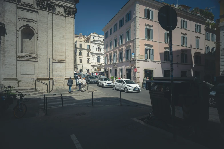 a street lined with buildings and tall white towers