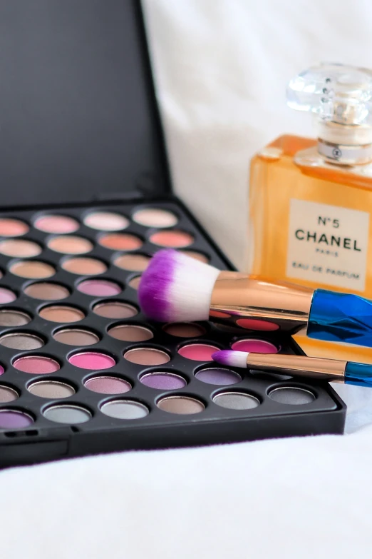 a bunch of makeup products sitting on top of a table