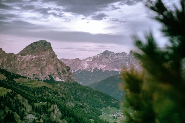 a view of mountains on top of a hill