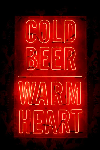 a neon sign that says cold beer, warm heart