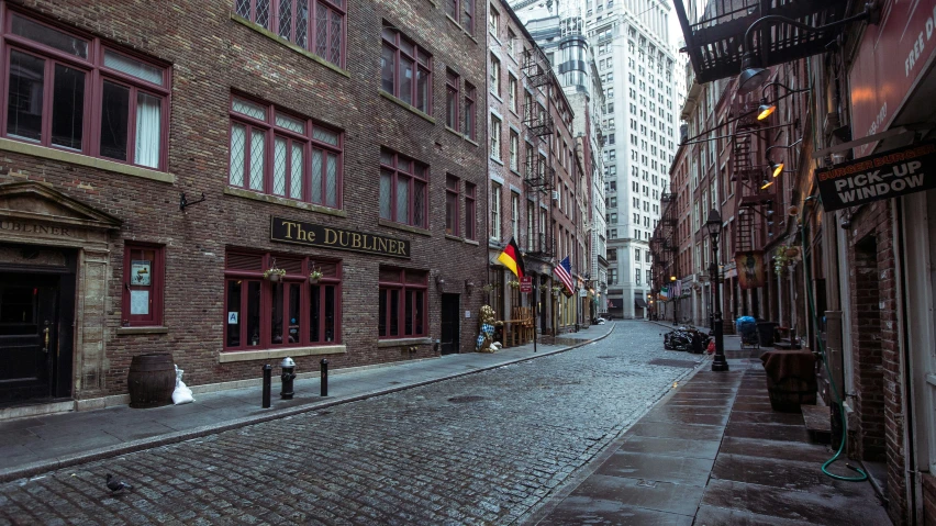 a cobbled street is pictured in the dark