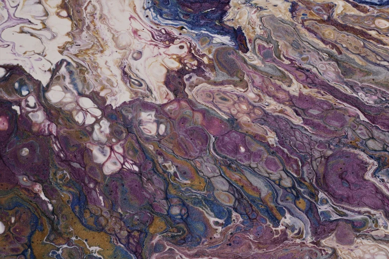 marbled paper has purple, blue and yellow streaks