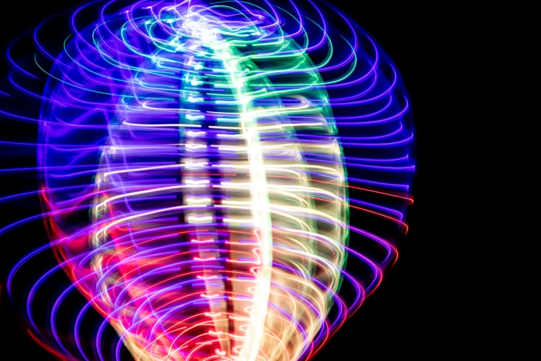 a long exposure picture of a colorful glowing object