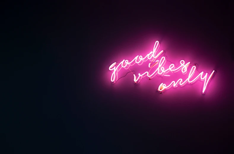 a neon sign that says good vibes only on it