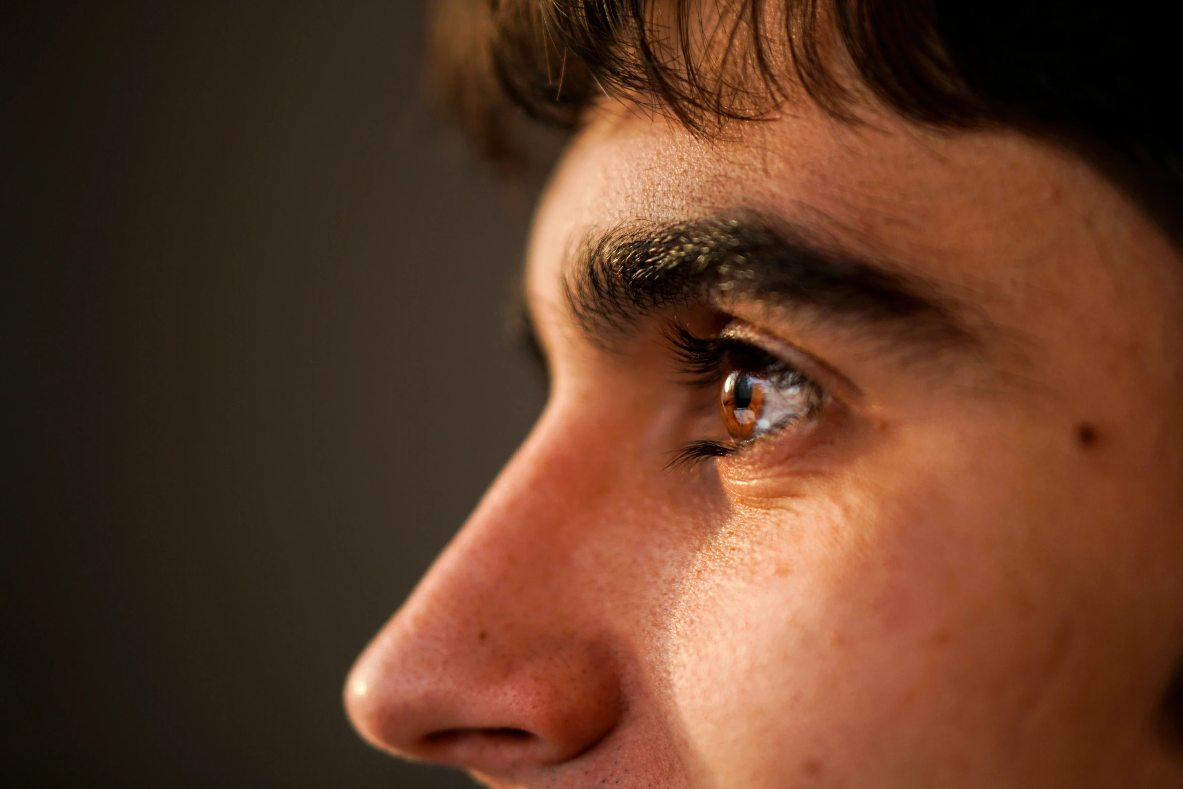 closeup of an adult male staring directly into the distance