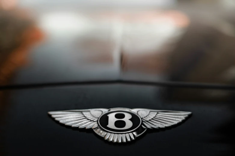 the number eight symbol on the hood of an old car