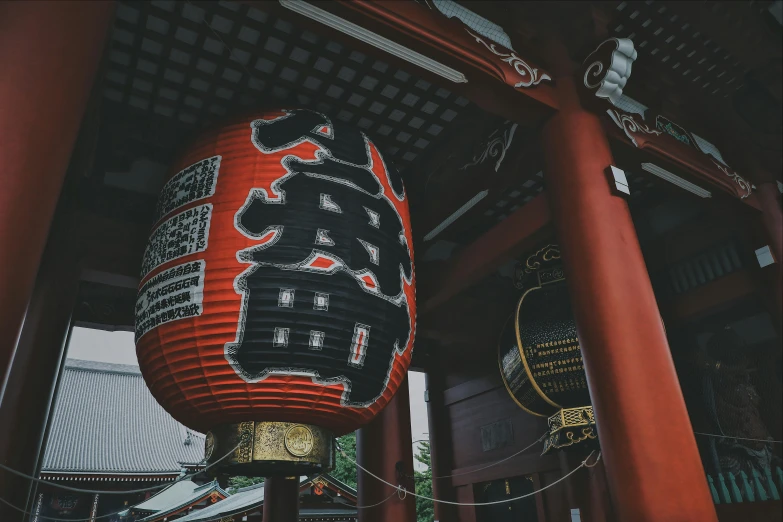 oriental style lanterns are in the center of a building