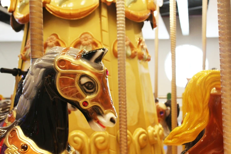 the merry go round horse features decorative patterns and colors