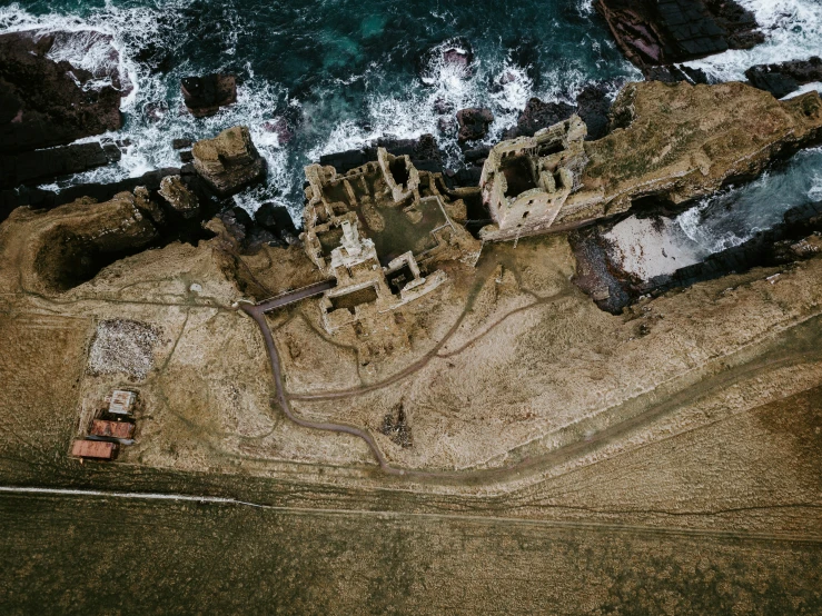 a bird's - eye view of an old castle on the shore