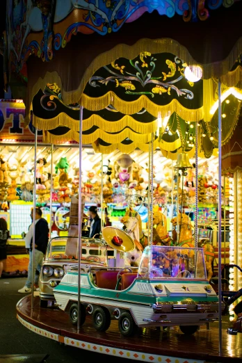 an amut park has a merry go round carousel with many colorful objects