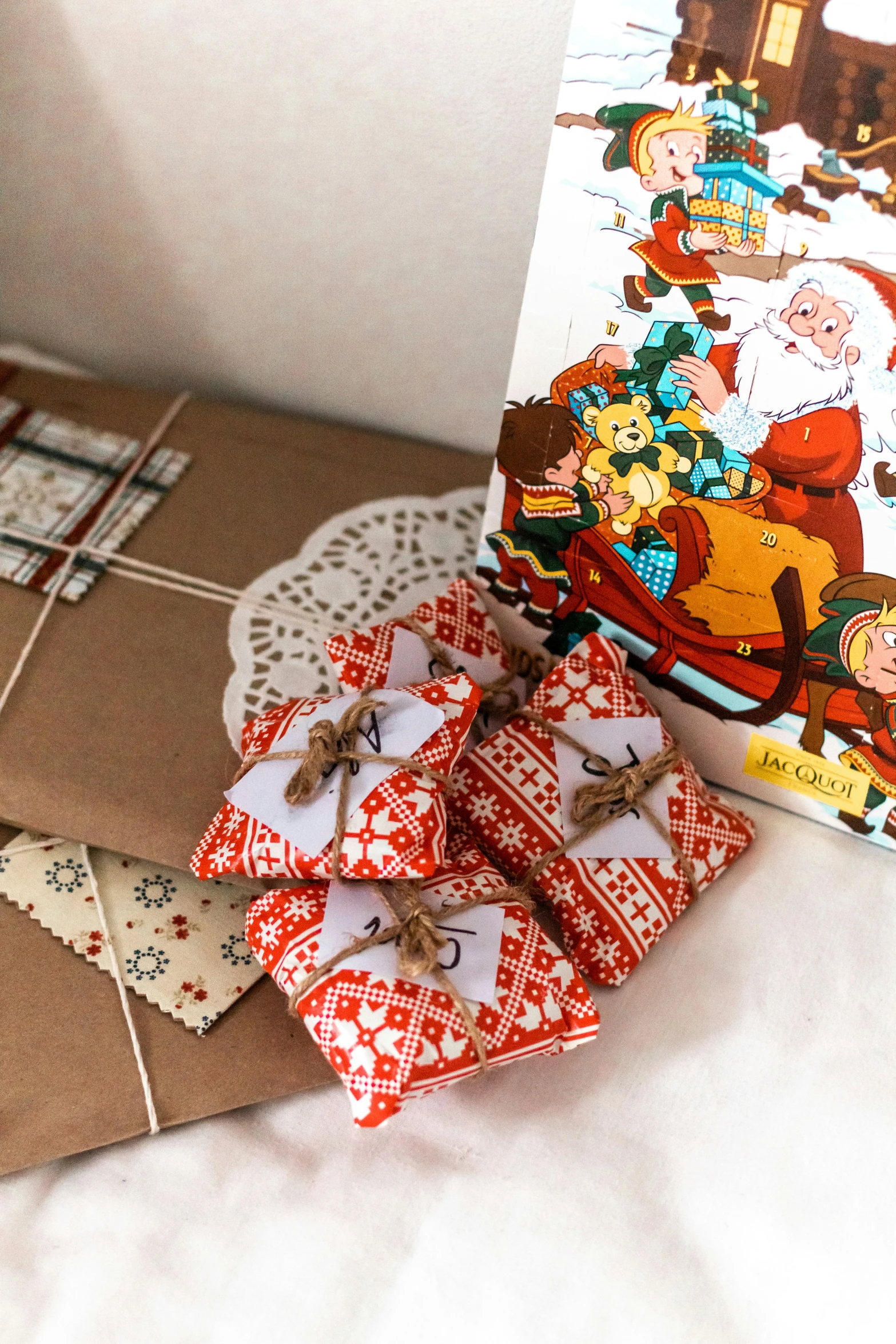 small pieces of fabric on a table with a small box