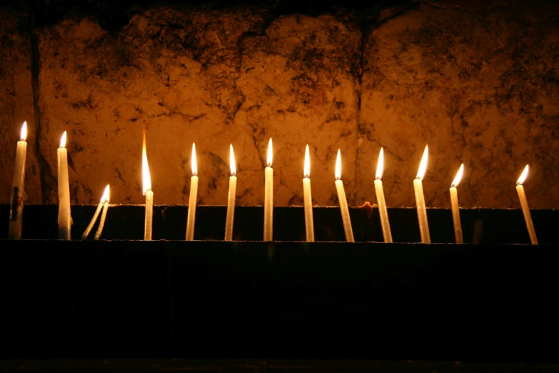 many candles that are on a table