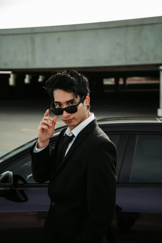 a man in a suit is talking on the phone