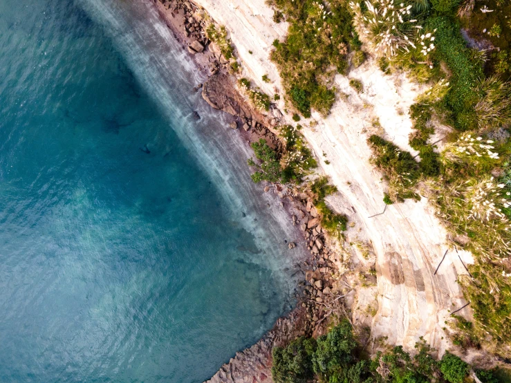 a very scenic area with clear water on the beach