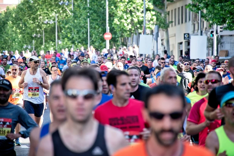 a group of people running down a street