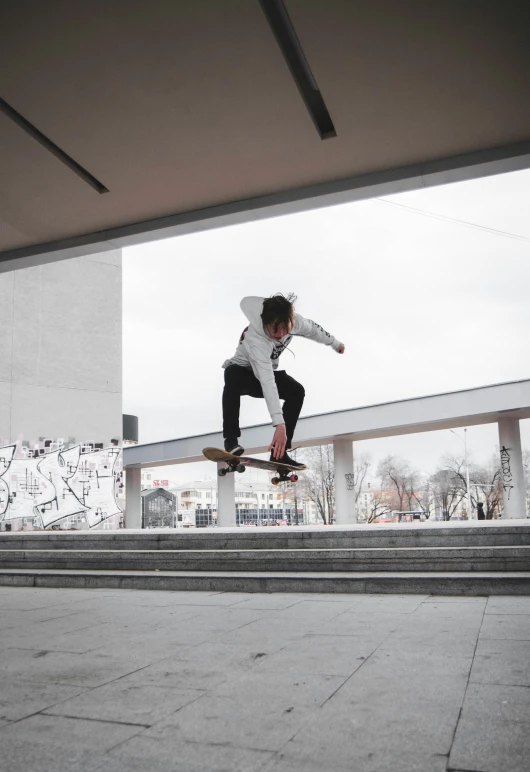 a young person doing a trick on a skateboard