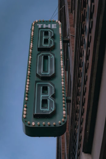 the neon sign on the side of a building