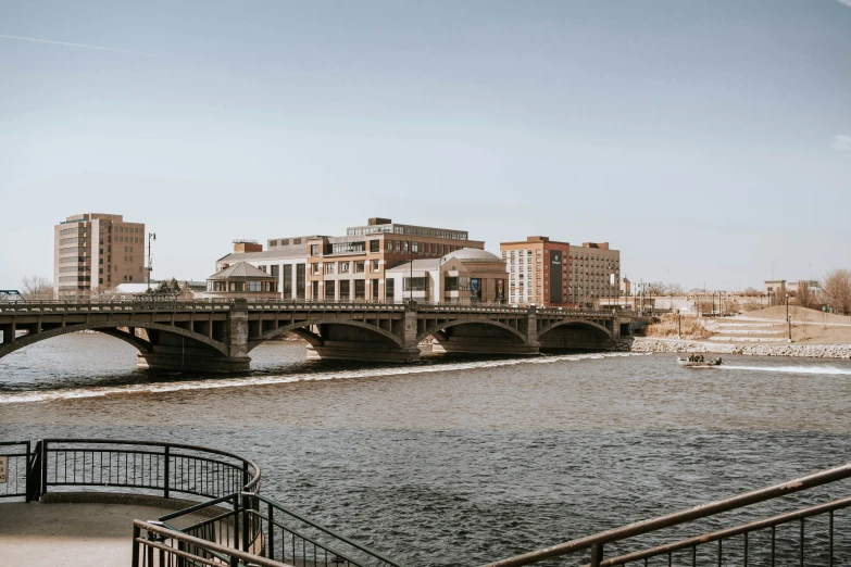 a bridge spans the width of a large river