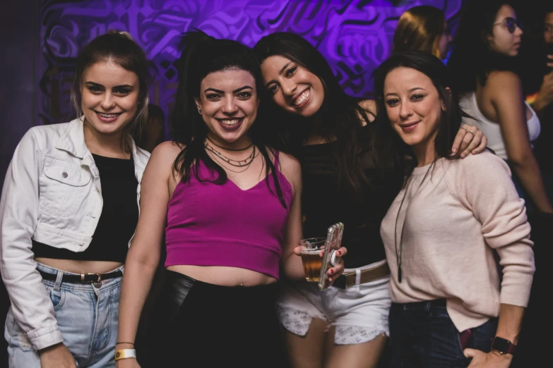 four friends having fun at a nightclub