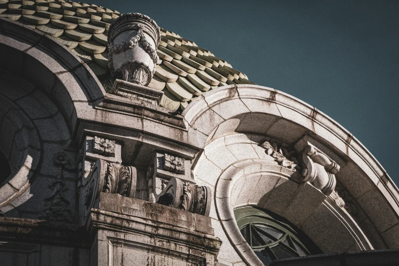 a building with some statues on it's roof