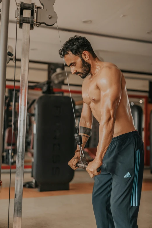 a man working on his muscles at the gym