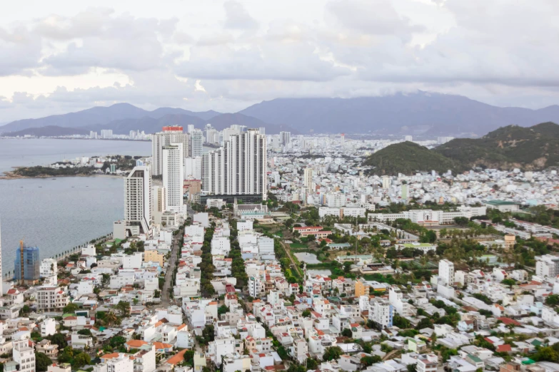 an aerial view of the city of a large city near a river