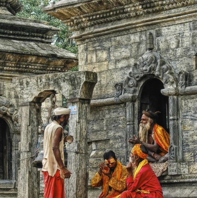 the man and women are all dressed up in traditional costume