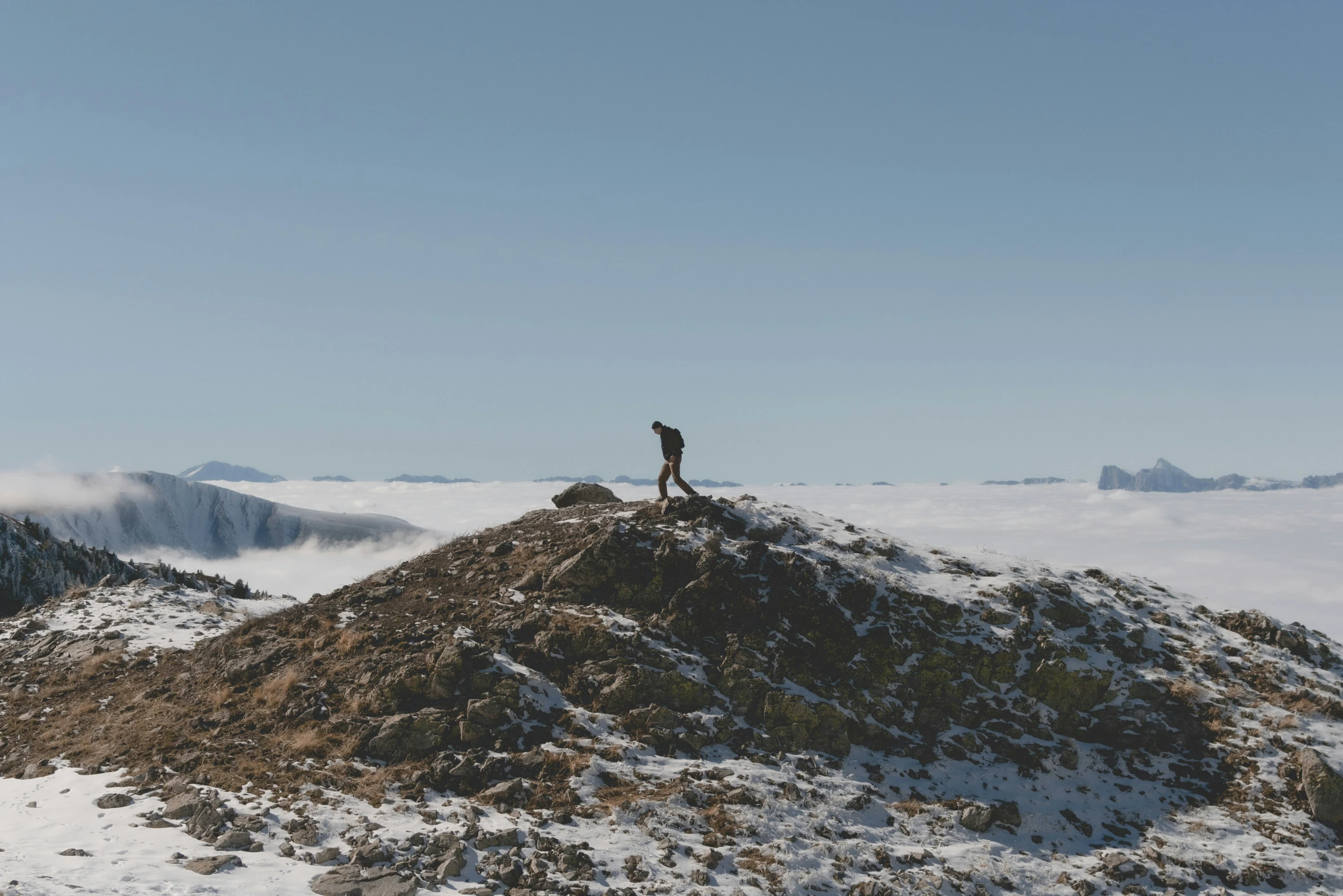 there is a person standing on the top of a mountain