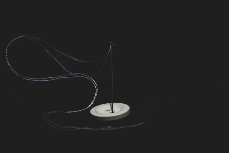 a spinning pendulum sitting on top of a wooden table