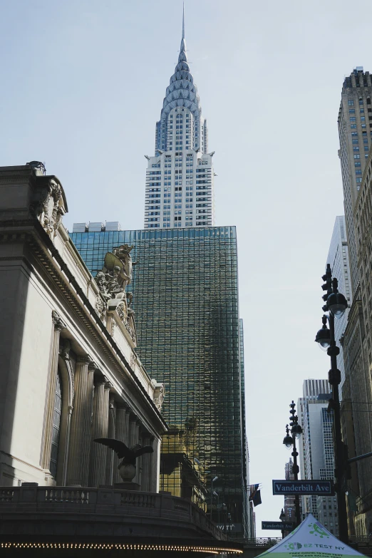 looking up at the top of the building from the street