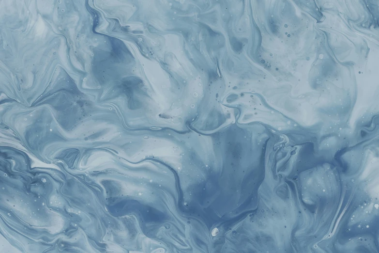 a blue and gray marble with streaks of light blue